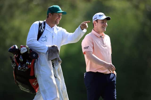Bob MacIntyre talks with his caddie Mikey Thomson on the 12th hole during his first practice round prior to the 86th Masters at Augusta National. Picture: David Cannon/Getty Images.