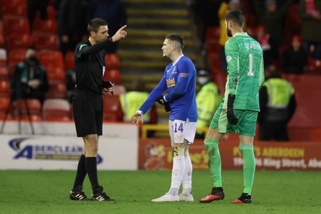 Referee Kevin Clancy sends off Rangers' Ryan Kent for a foul on Aberdeen's Scott Brown. (Photo by Craig Williamson / SNS Group)