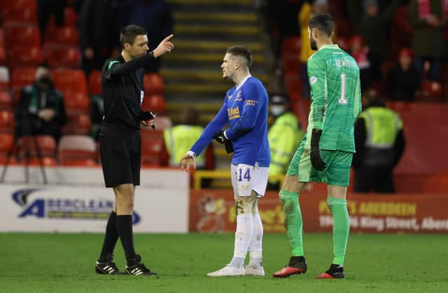 Referee Kevin Clancy sends off Rangers' Ryan Kent for a foul on Aberdeen's Scott Brown. (Photo by Craig Williamson / SNS Group)