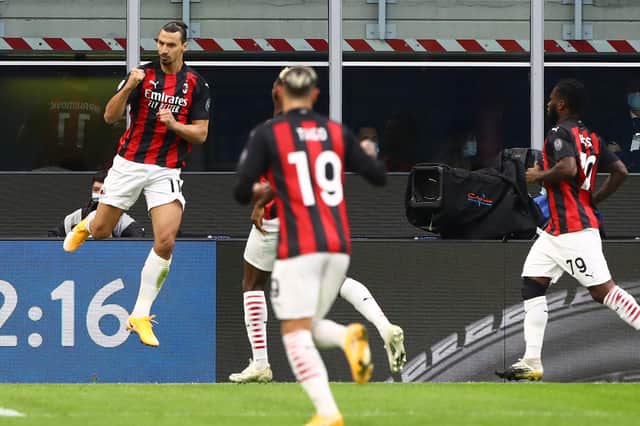 Zlatan Ibrahimovic (L) of AC Milan celebrates after scoring the opening goal during the Serie A match between FC Internazionale and AC Milan on Saturday (Photo by Marco Luzzani/Getty Images)