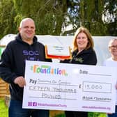 Asda Commmunity Champion Gillian Summers celebrates with Supporting Our Community.