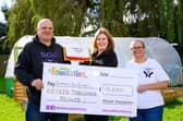 Asda Commmunity Champion Gillian Summers celebrates with Supporting Our Community.