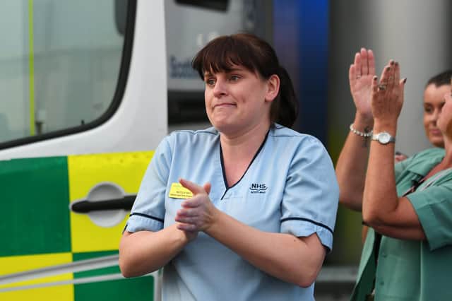 NHS staff clapping for carers in April