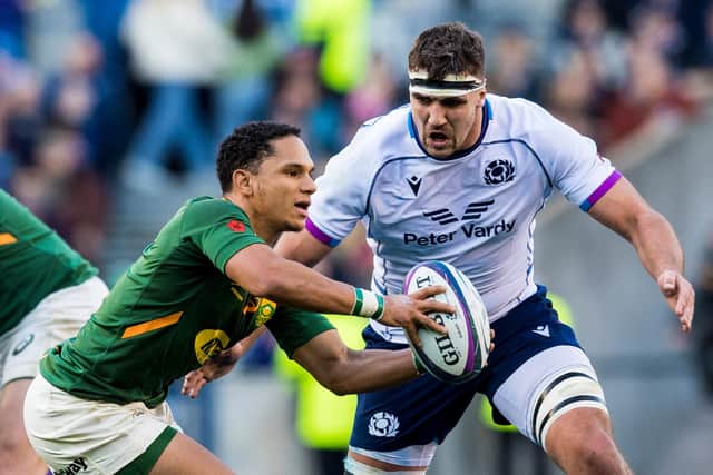 Scotland lock Sam Skinner closes in on South Africa scrum-half Herschel Jantjies.  (Photo by Ross Parker / SNS Group)