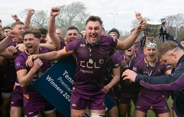 Marr RFC players celebrate with the Tennents Premiership trophy after defeating Currie Chieftains in the play-off final at Mallery Park. (Photo by Mark Scates / SNS Group)
