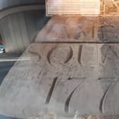 The preserved foundation stone can be seen at the northwest entrance to the centre. An accompanying plaque details the history of the site.