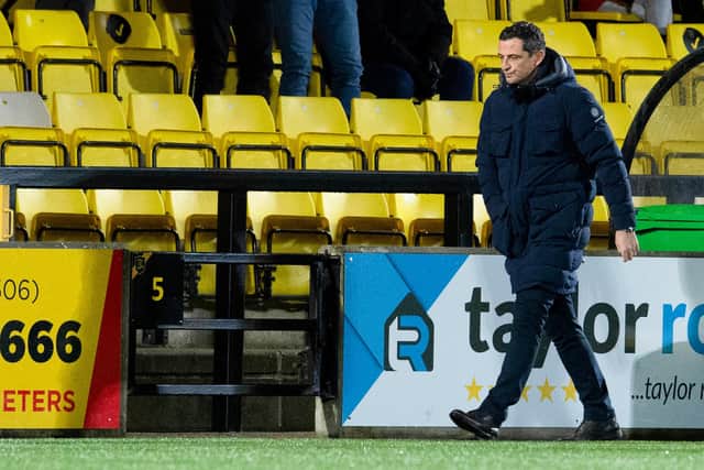 Jack Ross walks off to a chorus of boos from Hibs fans after his final match in charge. (Photo by Ross Parker / SNS Group)