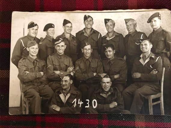 Trooper Trevor Baillie, of Corstorphine (back row, second left) fought with the Lothians and Border at St Valery and was later captured and held as a Prisoner of War. Twenty of his fellow fighters managed to escape and make their own way home. PIC: Contributed.