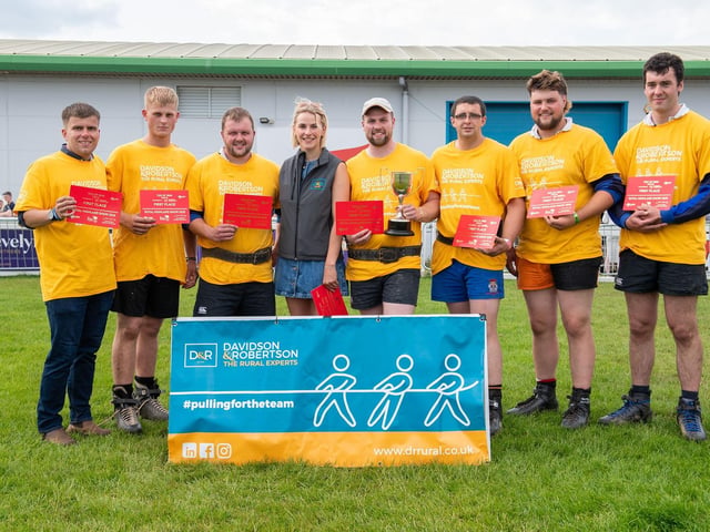 Strathearn Gents receive prizes from Davidson & Robertson's Vicky Haddow