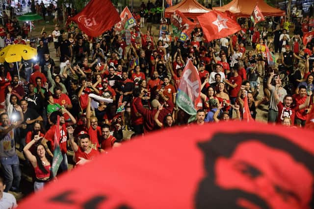 Supporter of Brazilian former President (2003-2010) and candidate for the leftist Workers Party (PT) Luiz Inacio Lula da Silva react as they watch the vote count of the legislative and presidential election, in Brasilia, Brazil, on October 2, 2022 Photo by SERGIO LIMA/AFP via Getty Images