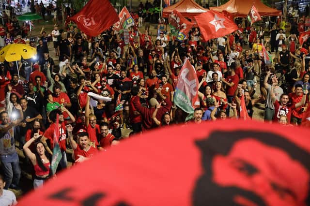 Supporter of Brazilian former President (2003-2010) and candidate for the leftist Workers Party (PT) Luiz Inacio Lula da Silva react as they watch the vote count of the legislative and presidential election, in Brasilia, Brazil, on October 2, 2022 Photo by SERGIO LIMA/AFP via Getty Images