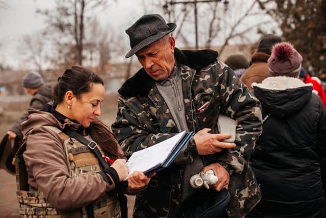 An aid worker from Heritage Ukraine drops off vital supplies to villagers in the east of Ukraine.