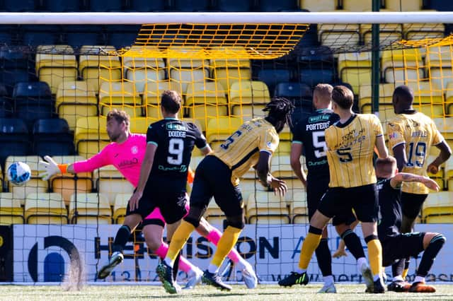 Ayo Obileye heads beyond Hibs goalkeeper David Marshall for a late winner at the Tony Macaroni Arena. Picture: SNS