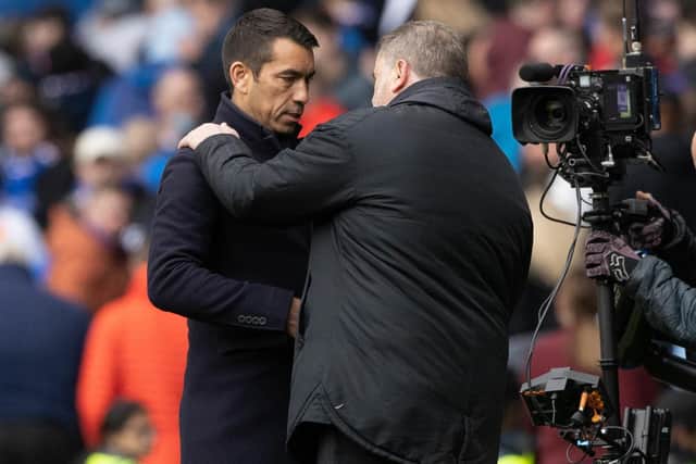 Celtic manager Ange Postecoglou greets Rangers counterpart Giovanni van Bronckhorst  before the Ibrox clash between their sides a fortnight ago and believes it is right to see the Scottish Cup semi-final as an occasion that will see two good teams go toe-to-toe.  (Photo by Craig Williamson / SNS Group)