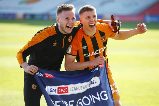 Former Rangers midfielder Greg Docherty (right) celebrates Hull City's promotion with team mate James Scott (Photo by Joe Portlock/Getty Images)