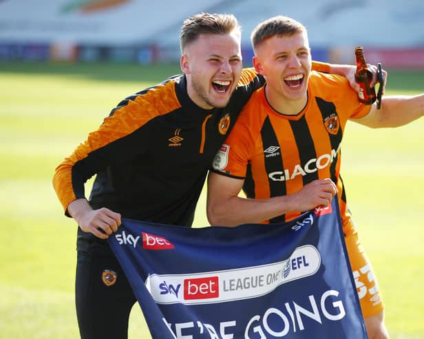 Former Rangers midfielder Greg Docherty (right) celebrates Hull City's promotion with team mate James Scott (Photo by Joe Portlock/Getty Images)