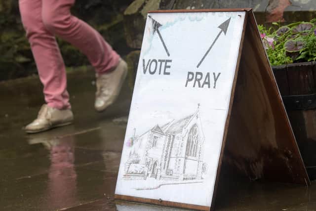 A sign outside a polling station at St James Church in Edinburgh on June 8, 2017 (Picture: Lesley Martin/AFP via Getty Images)