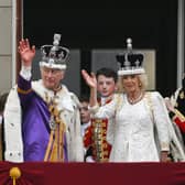 King Charles III and Queen Camilla wave from the Buckingham Palace balcony. Picture: Brandon Bell/Getty Images