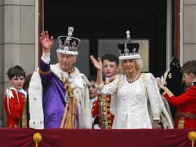 King Charles III and Queen Camilla wave from the Buckingham Palace balcony. Picture: Brandon Bell/Getty Images