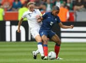 Faye White challenges Marie-Laure Delie of France during the FIFA Women's World Cup 2011 - one of four major tournament appearances for the former Lionesses captain (Photo by Christof Koepsel/Getty Images)