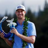 Harris English of the United States poses with the trophy after defeating Joaquin Niemann in a play-off in the Sentry Tournament Of Champions at the Kapalua Plantation Course in Hawaii. Picture: Cliff Hawkins/Getty Images.