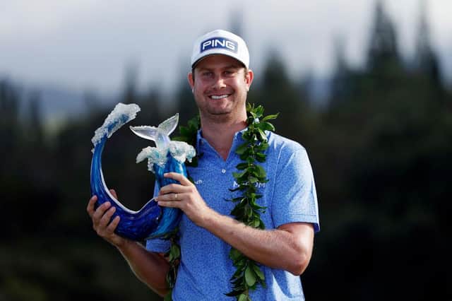 Harris English of the United States poses with the trophy after defeating Joaquin Niemann in a play-off in the Sentry Tournament Of Champions at the Kapalua Plantation Course in Hawaii. Picture: Cliff Hawkins/Getty Images.