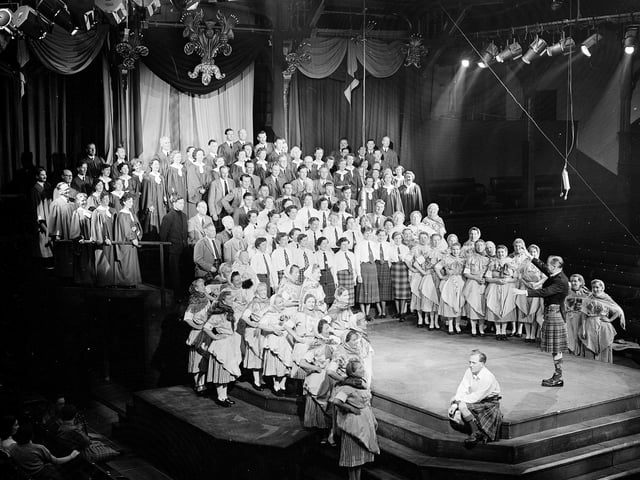 Members of the Newhaven Fisher Lassies Choir (among others) take part in  Edinburgh International Festival society production Hail Caledonia! in the Assembly Hall, in August 1954.