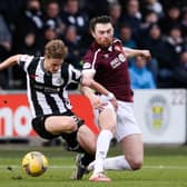 PAISLEY, SCOTLAND - FEBRUARY 26: Alex Greive (L) is tackled by John Souttar of Hearts during a Cinch Premiership match between St. Mirren and Hearts of Midlothian at SMiSA Stadium, on February 26, in Paisley, Scotland.  (Photo by Alan Harvey / SNS Group)