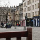 Pubs and restaurants in Edinburgh's Grassmarket have been hit by restrictions