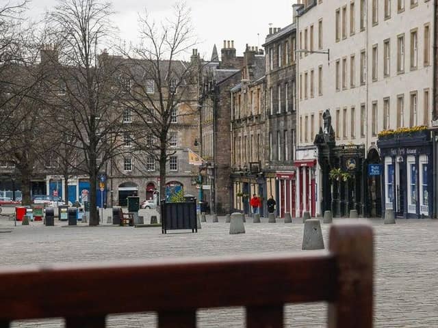 Pubs and restaurants in Edinburgh's Grassmarket have been hit by restrictions
