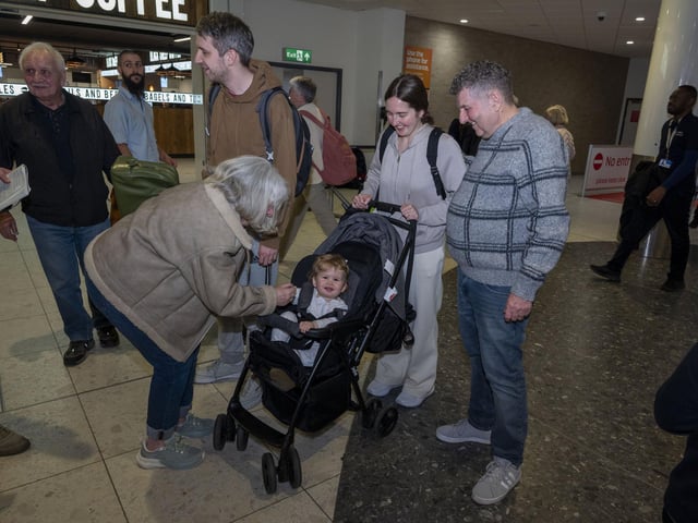 Reunited: Passengers arrive home on Emirates flight