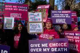 Campaigners hold placards in support of assisted dying in November last year in London. Picture: Carl Court/Getty Images