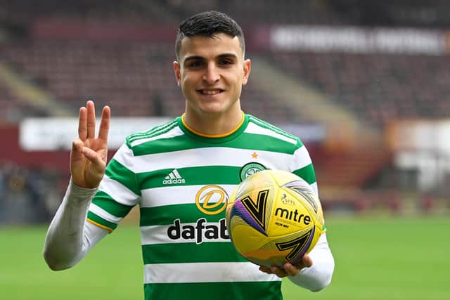 Celtic's Mohamed Elyounoussi gives three reasons why he believes Chris Sutton was wrong to question him as he holds the match ball after his hat-trick at Motherwell (Photo by Rob Casey / SNS Group)
