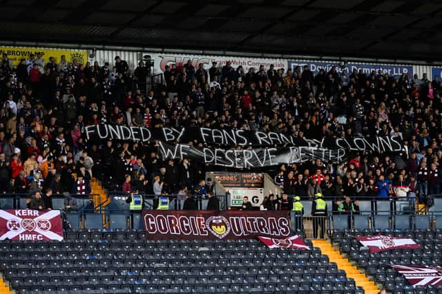 Hearts' fans hold up a banner to voice their frustrations with the board ahead of the game against Kilmarnock.