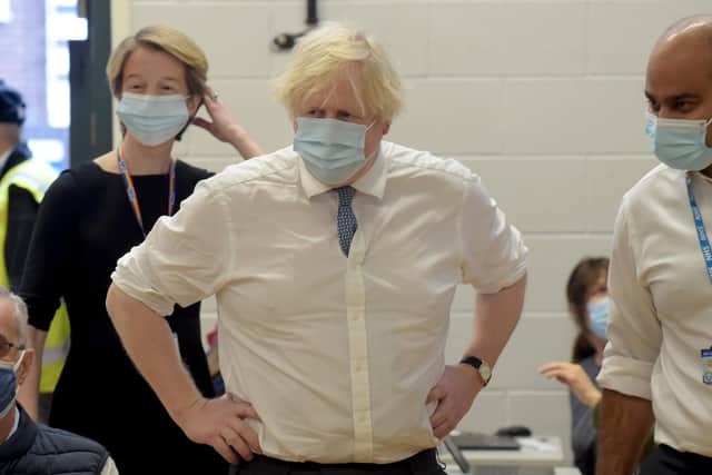 British Prime Minister Boris Johnson visits Stow Health Vaccination centre in Westminster on December 13, 2021 in London, England. (Photo by Jeremy Selwyn - WPA Pool/Getty Images)