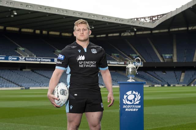Glasgow Warriors hooker Johnny Matthews with the 1872 Cup. (Photo by Paul Devlin / SNS Group)
