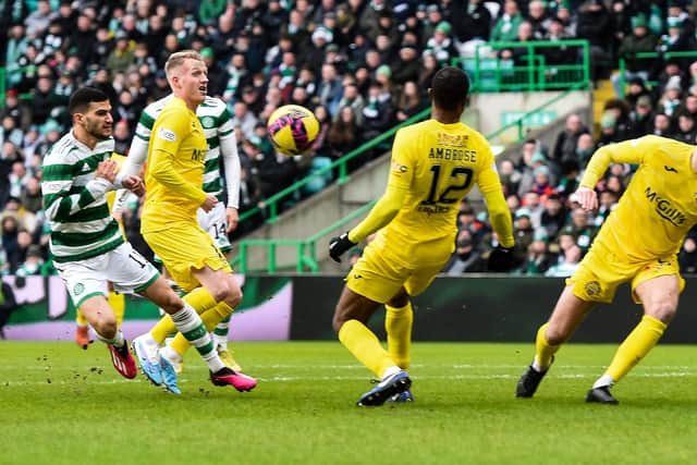 Celtic are awarded a penalty for hand ball against Morton defender Efe Ambrose. (Photo by Ross MacDonald / SNS Group)