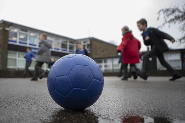 School children playing during a break. The two-child benefit cap has affected more than 80,000 children in Scotland in the last year, research commissioned by the SNP has found. Picture: Danny Lawson/PA Wire