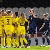 Scotland's Christy Grimshaw looks dejected as Sweden celebrate their opener. Picture: SNS