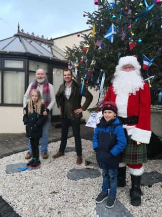 Twinning Group Christmas peace tree was switched on at Kirktown Garden Centre.