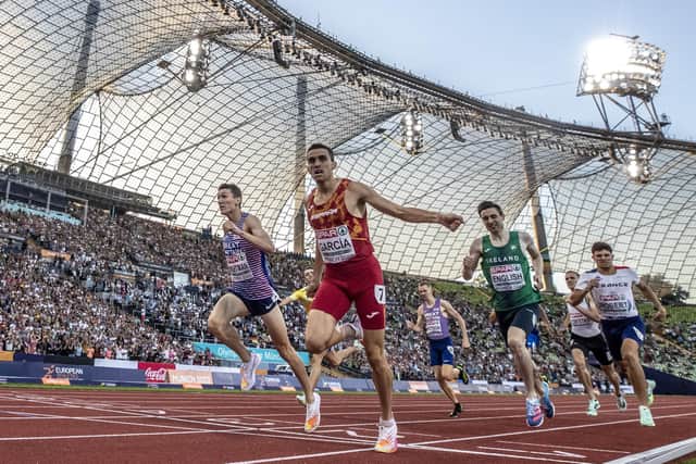 Gold medalist Mariano Garcia of Spain crosses the finish line next to Silver medalist Jake Wightman of Great Britain and Bronze medalist Mark English of Ireland during the Athletics - Men's 800m Final day 11 of the European Championships Munich 2022 at Olympiapark on August 21, 2022 in Munich, Germany. (Photo by Maja Hitij/Getty Images)