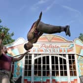 Arthur Parsons and Adam Fullick from experimental acrobatic circus company Barely Methodical Troupe limber up at George Square Gardens. Picture: Andrew Milligan/PA Wire