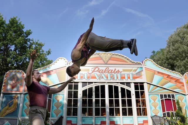 Arthur Parsons and Adam Fullick from experimental acrobatic circus company Barely Methodical Troupe limber up at George Square Gardens. Picture: Andrew Milligan/PA Wire
