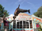 Arthur Parsons and Adam Fullick from experimental acrobatic circus company Barely Methodical Troupe limber up at George Square Gardens. Picture: Andrew Milligan/PA Wire