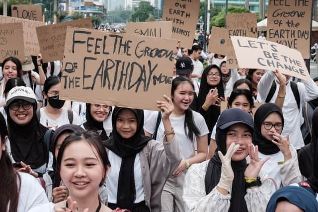 Environmental protesters gather in Jakarta, Indonesia, to call for action on climate change ahead of this year's international Earth Day