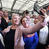 Northern Ireland's Sinn Féin leader Michelle O'Neill and Ireland's Sinn Féin leader Mary Lou McDonald pose for a selfie with colleagues and supporters as the votes are counted (Picture: Charles McQuillan/Getty Images)