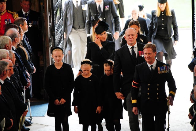 Savannah Phillips (left) Zara Tindall (centre) and Ilsa Phillips (second left), Lena Tindall and Mike Tindall (second right) arrive at the Committal Service for Queen Elizabeth II held at St George's Chapel in Windsor Castle, Berkshire. Picture date: Monday September 19, 2022.