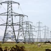 Overhead power cables. The National Grid has asked for two coal-fired power stations to warm up to meet potential energy demand. Picture: Gareth Fuller/PA Wire