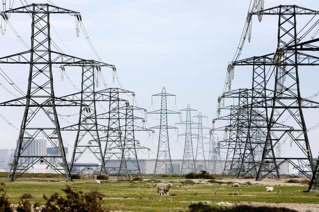 Overhead power cables. The National Grid has asked for two coal-fired power stations to warm up to meet potential energy demand. Picture: Gareth Fuller/PA Wire