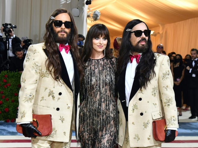 TOPSHOT - (L-R) Jared Leto, Dakota Johnson and Alessandro Michele arrive for the 2022 Met Gala at the Metropolitan Museum of Art on May 2, 2022, in New York. Photo by ANGELA  WEISS/AFP via Getty Images)
